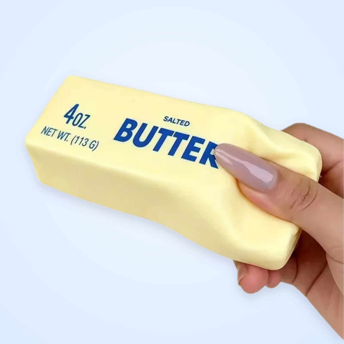 Classic Butter Stick Squishy being squeezed
