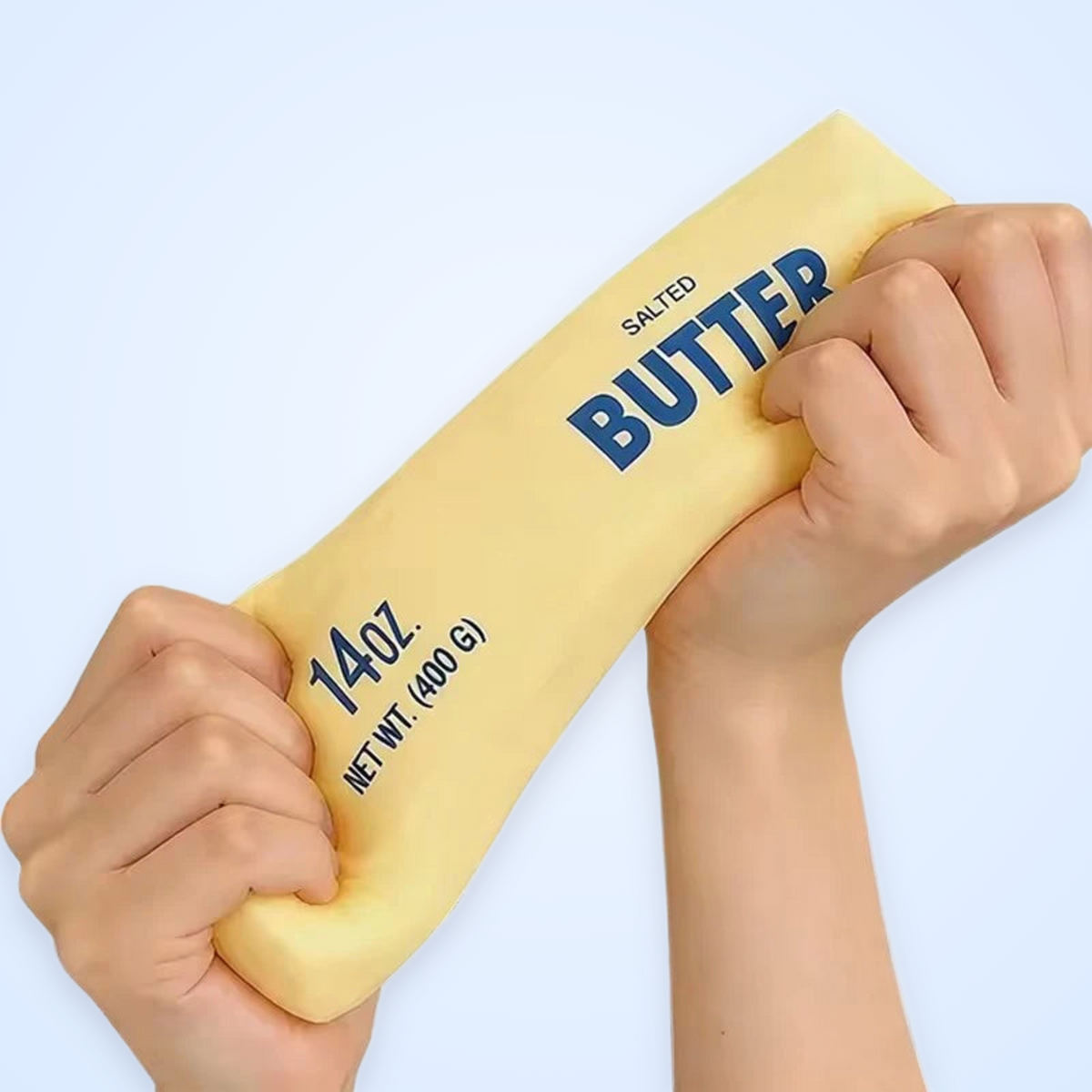 Jumbo Butter Stick Squishy stretched in two hands